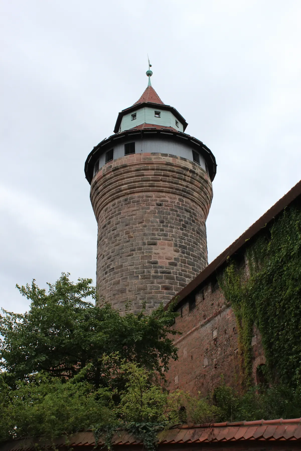 The round sandstone Sinwell Tower of the Imperial Castle with its pointed roof