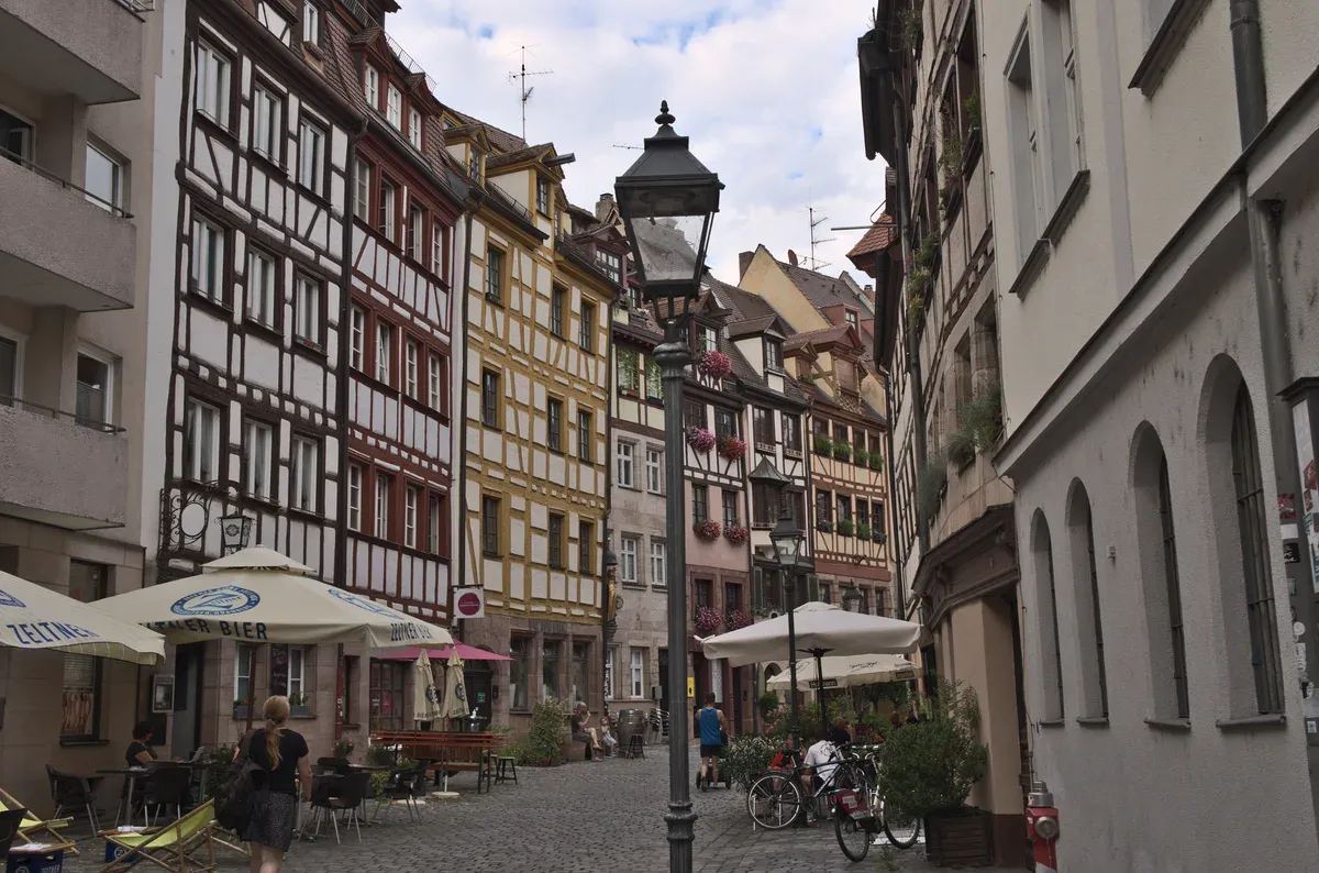 Half-timbered and painted houses along the cobbled Weissgerbergasse in Nuremberg